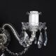 Antique wall light with 2 lights from the 1900s, featuring crystal bobeches and pendants.