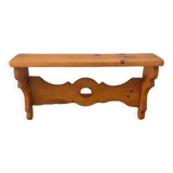 Rustic honey-colored varnished pine shelf