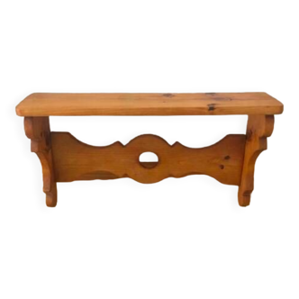 Rustic honey-colored varnished pine shelf