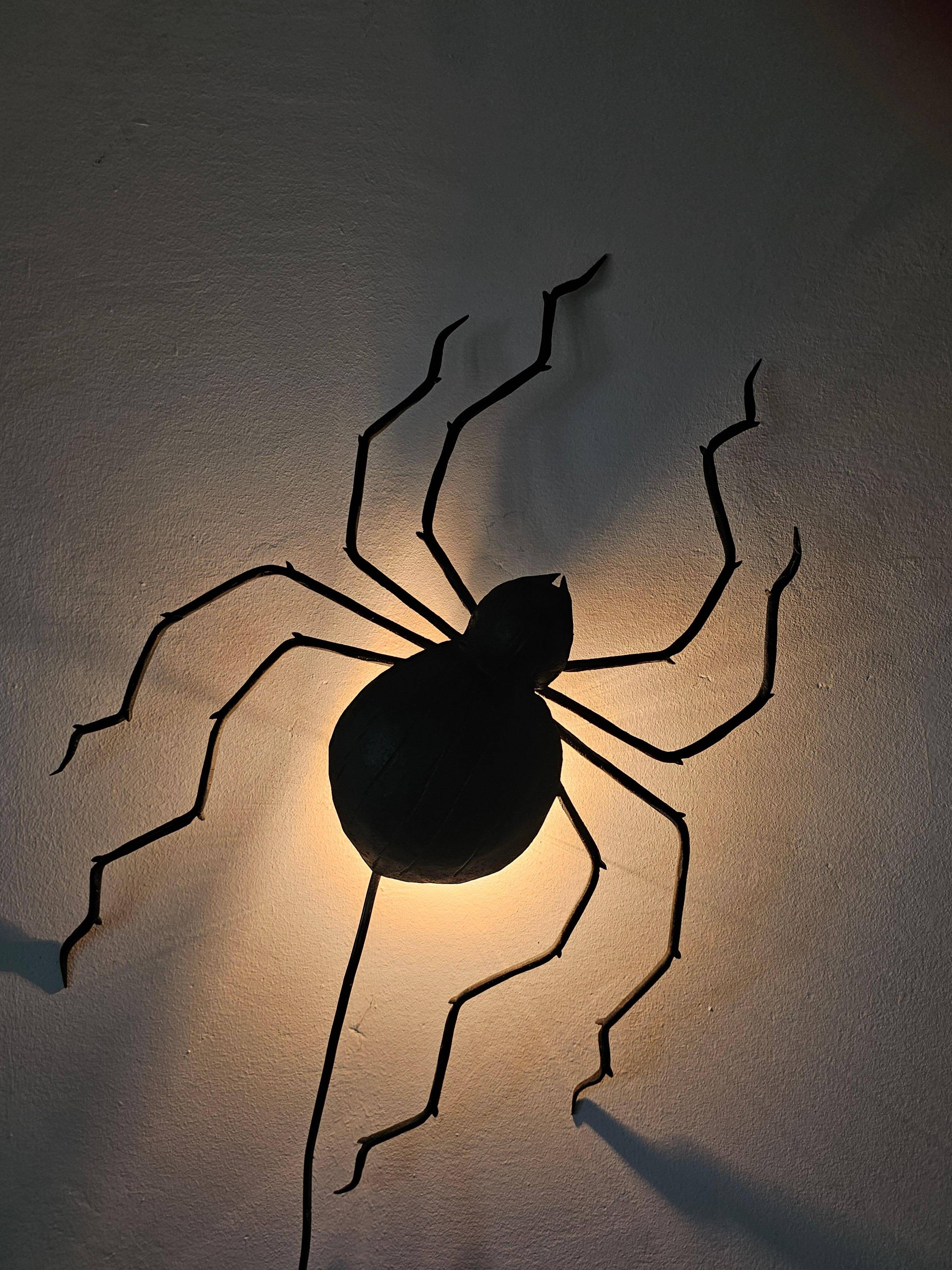 Wall lamp in iron Mid Century Modern spider style from the 1960s.