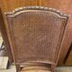 Chair with caned seat and back made of wood