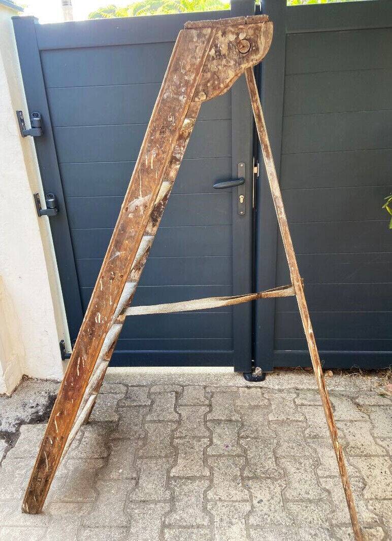 Antique authentic painter's stepladder in vintage patinated wood