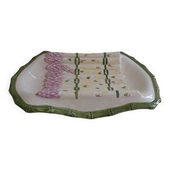 Plate of asparagus with a sauce.