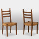 Ensemble de 8 chaises paillées en chêne. Années 1950.