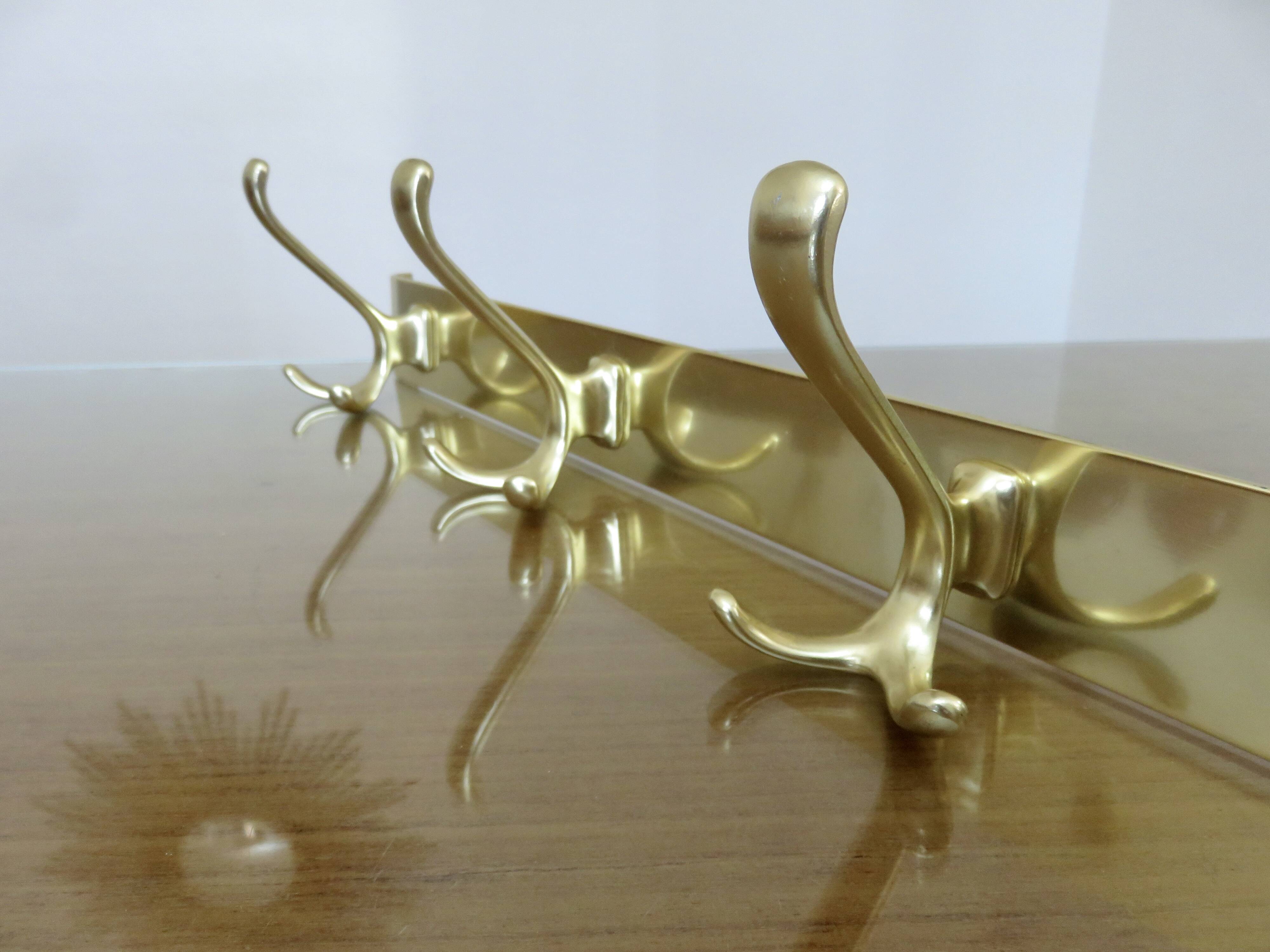 Large wall-mounted coat rack in gold aluminum, 60s-70s
