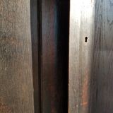 Old black wardrobe - wooden drawers and labels of origin