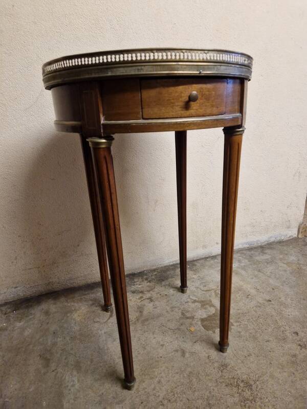 Louis XVI style bouillotte table in mahogany with a grey marble top.