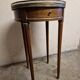 Louis XVI style bouillotte table in mahogany with a grey marble top.