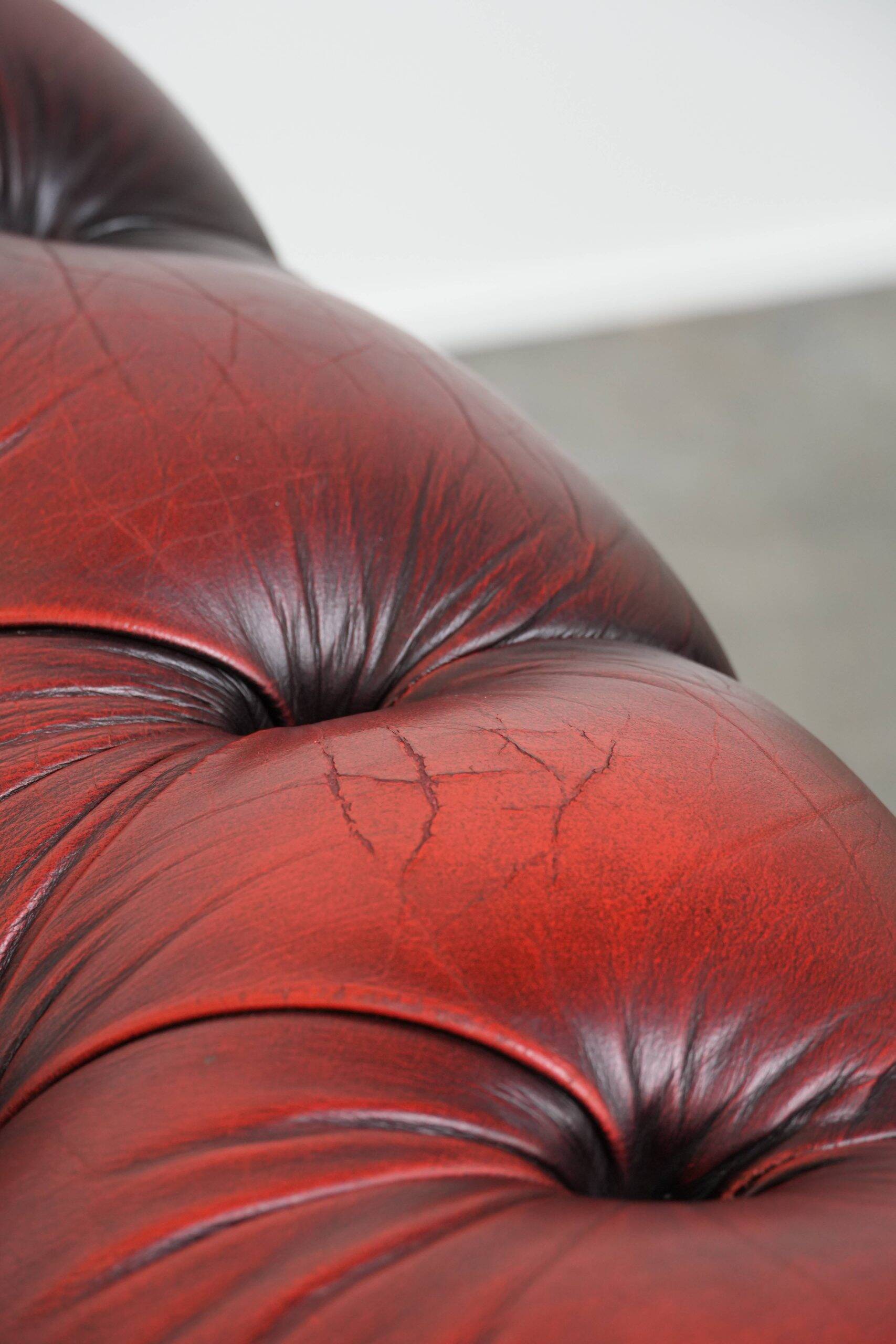 Classic cowhide Chesterfield button seat armchair in a beautiful red colour