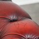 Classic cowhide Chesterfield button seat armchair in a beautiful red colour