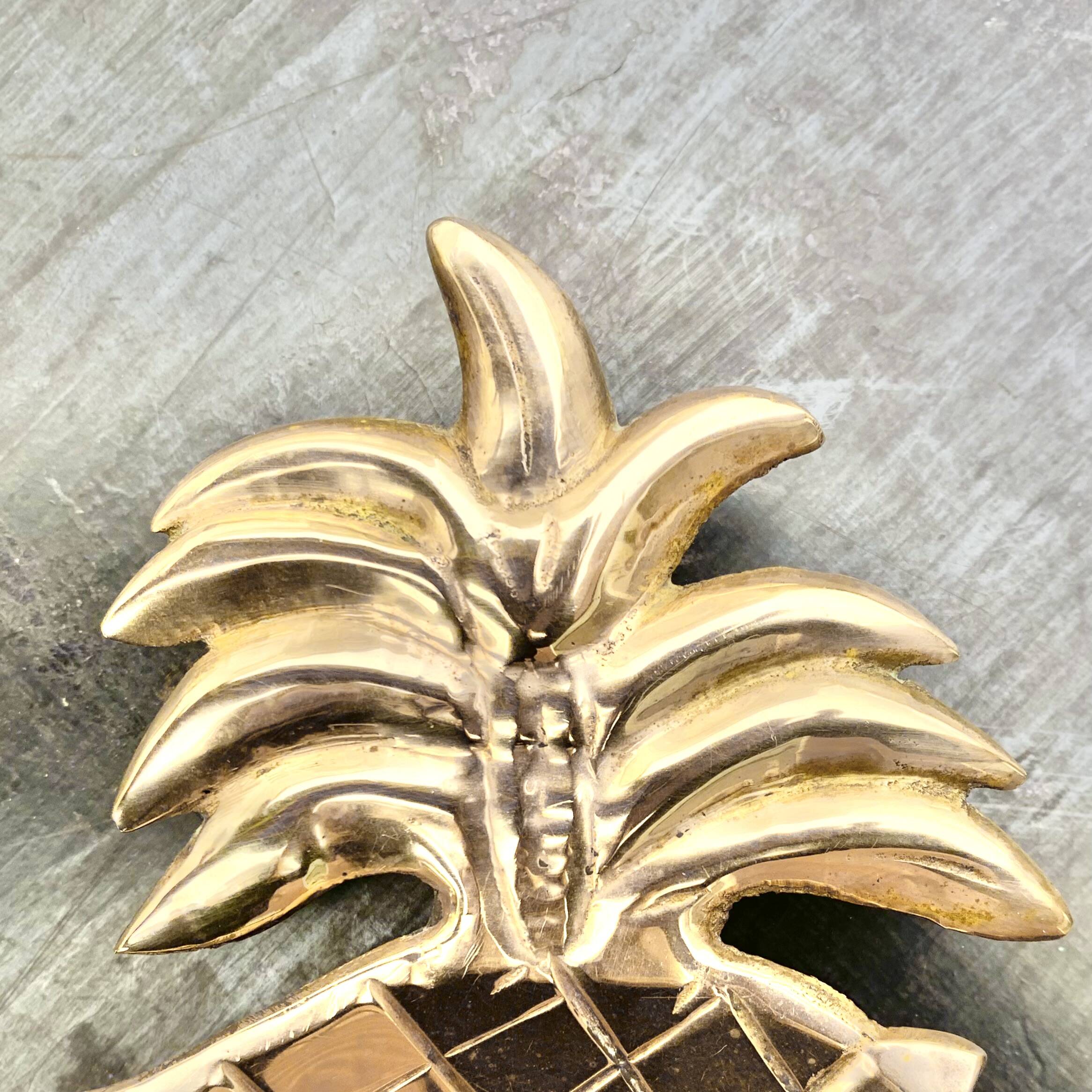 Vintage brass pineapple pocket emptier