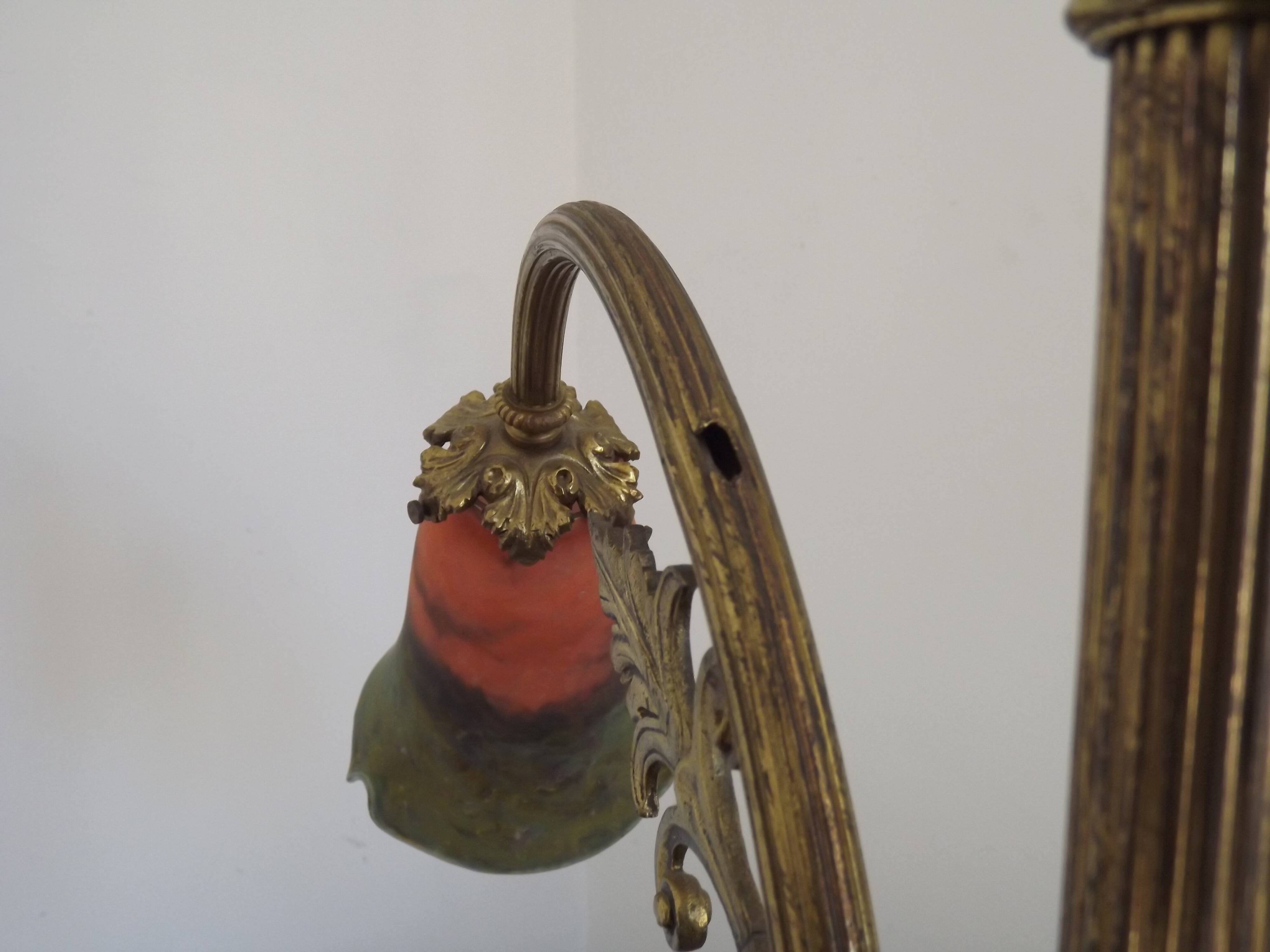 Art Nouveau three-light chandelier in bronze with orange and green glass shade, France.