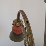 Art Nouveau three-light chandelier in bronze with orange and green glass shade, France.