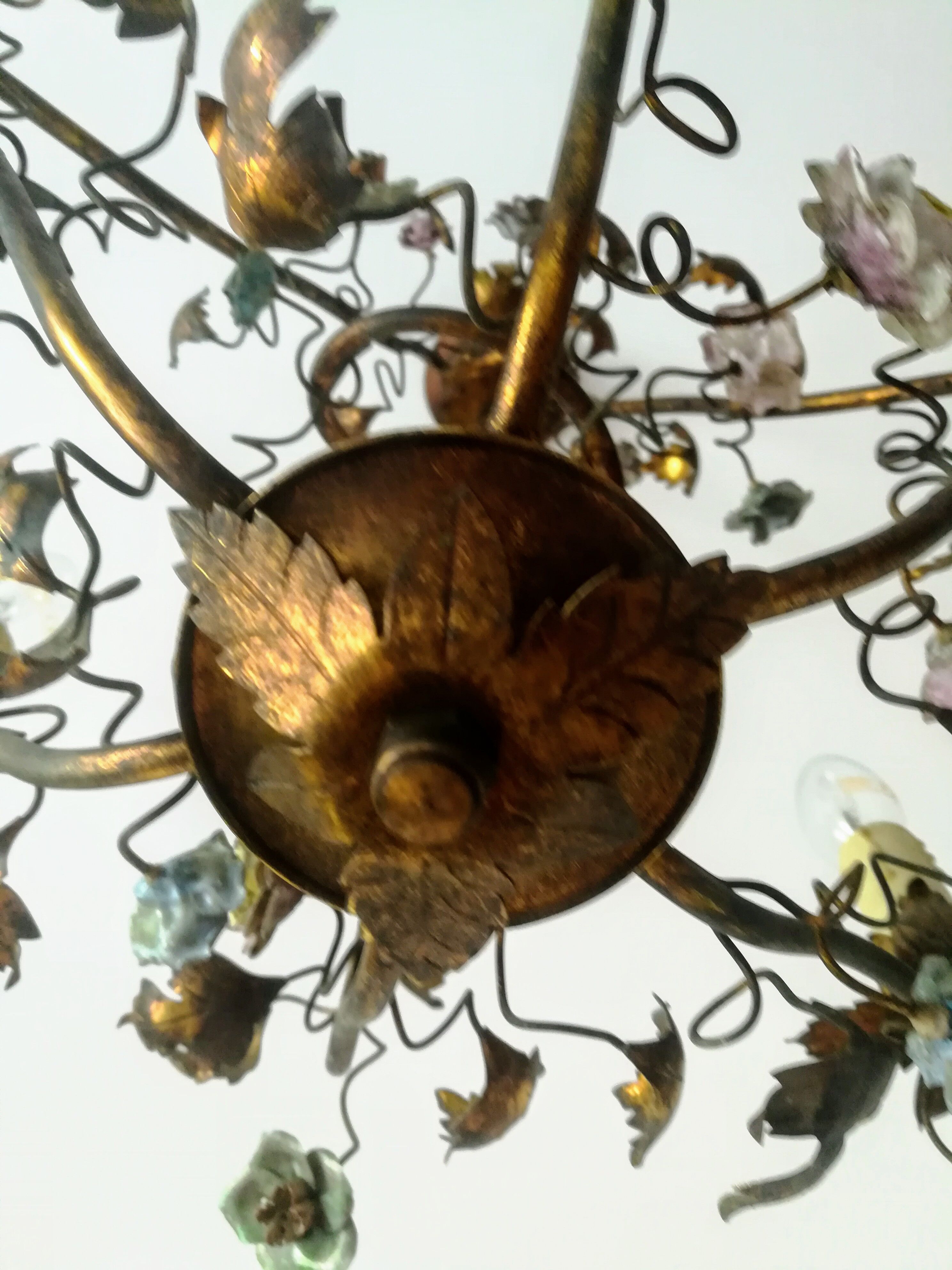 Brass chandelier and porcelain flowers