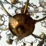 Brass chandelier and porcelain flowers
