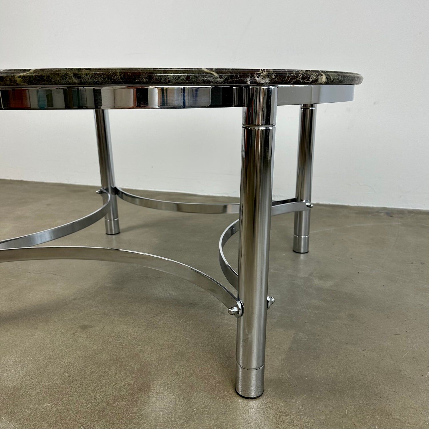 Coffee table with marble top and chrome base
