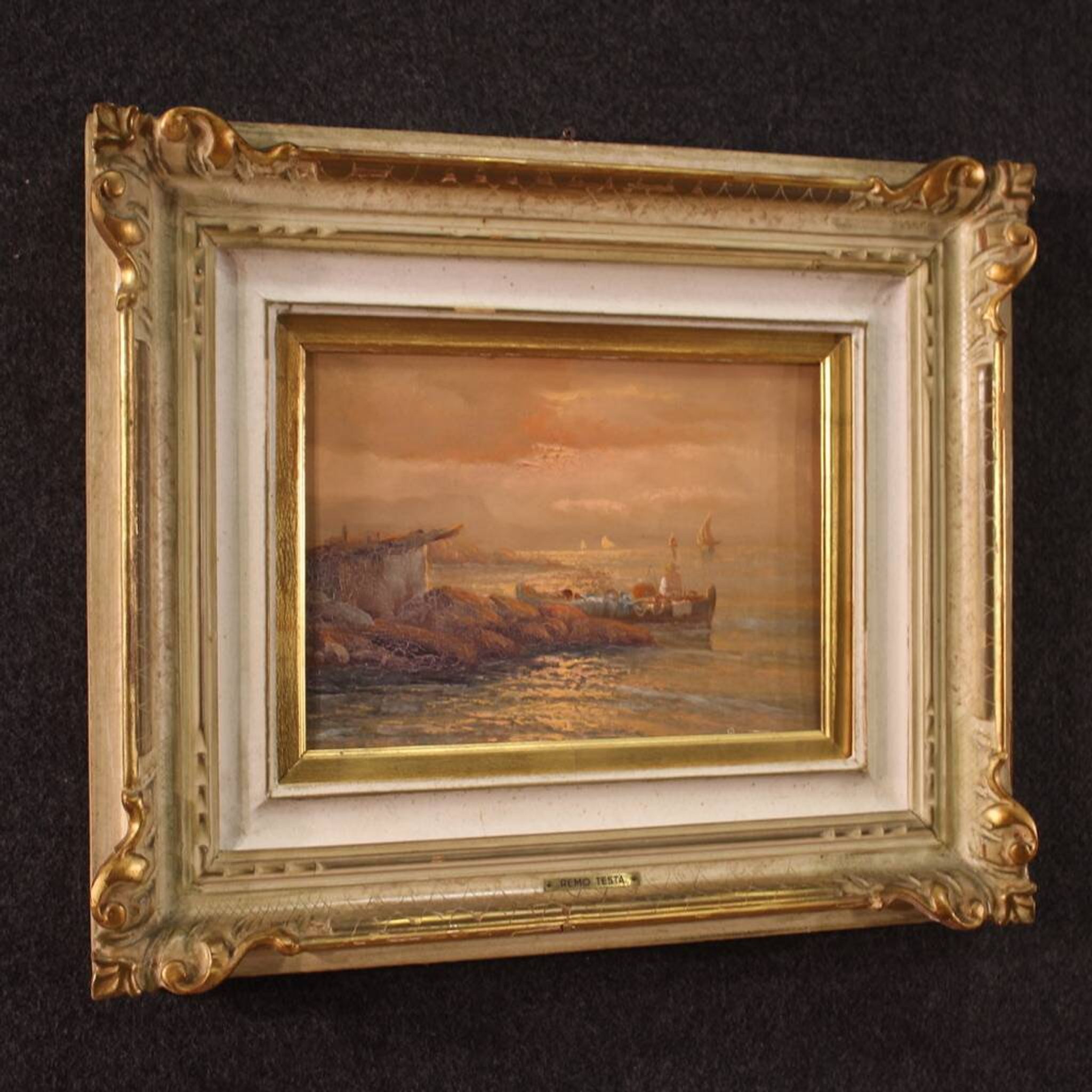 Seascape painting signed by Remo Testa, fishermen at sunset