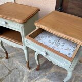 Renovated bedside tables in laurel green and light wood.
