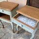 Renovated bedside tables in laurel green and light wood.