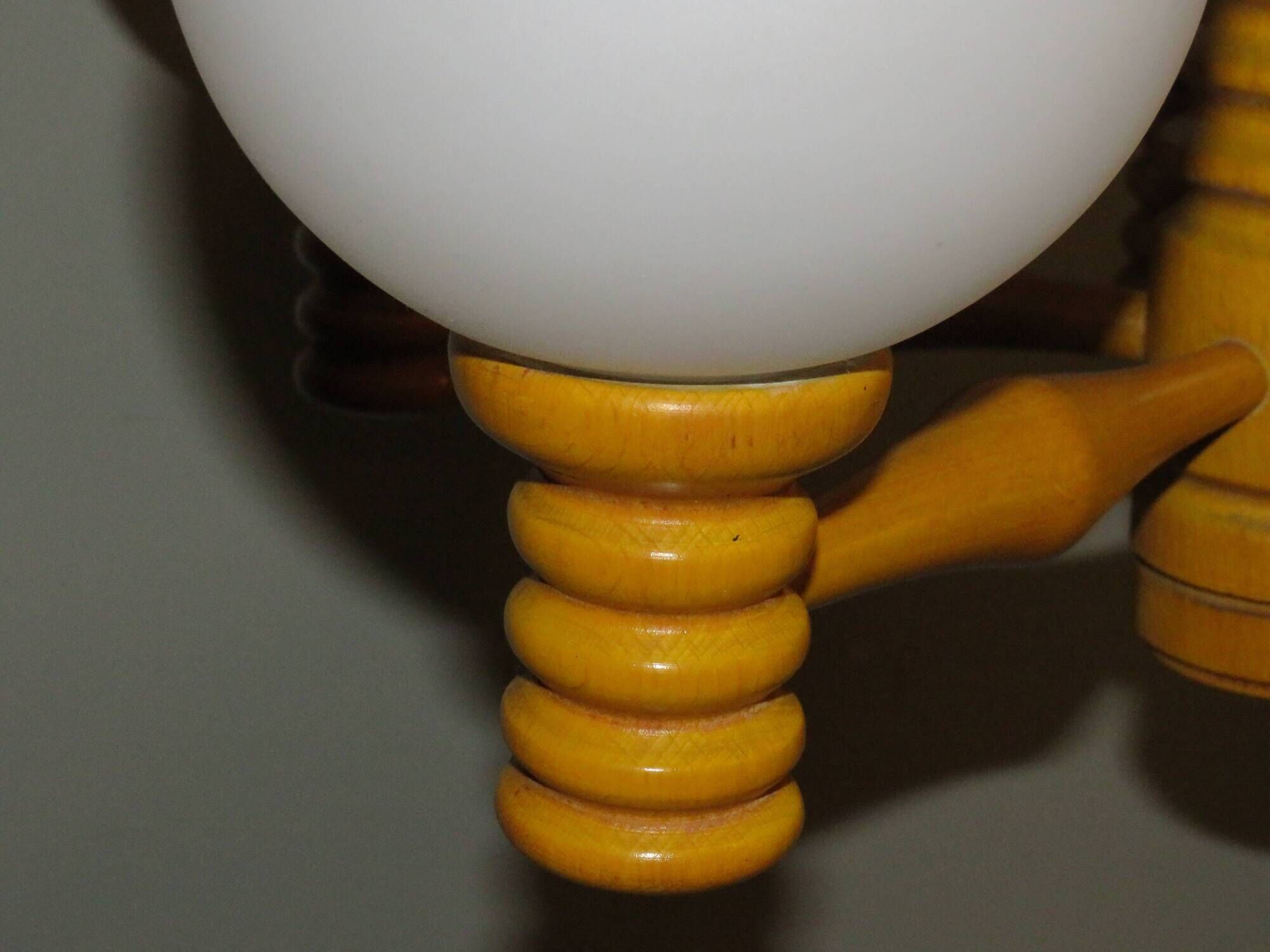 Space age chandelier in 5-arm wood with white frosted opaline glass spheres.