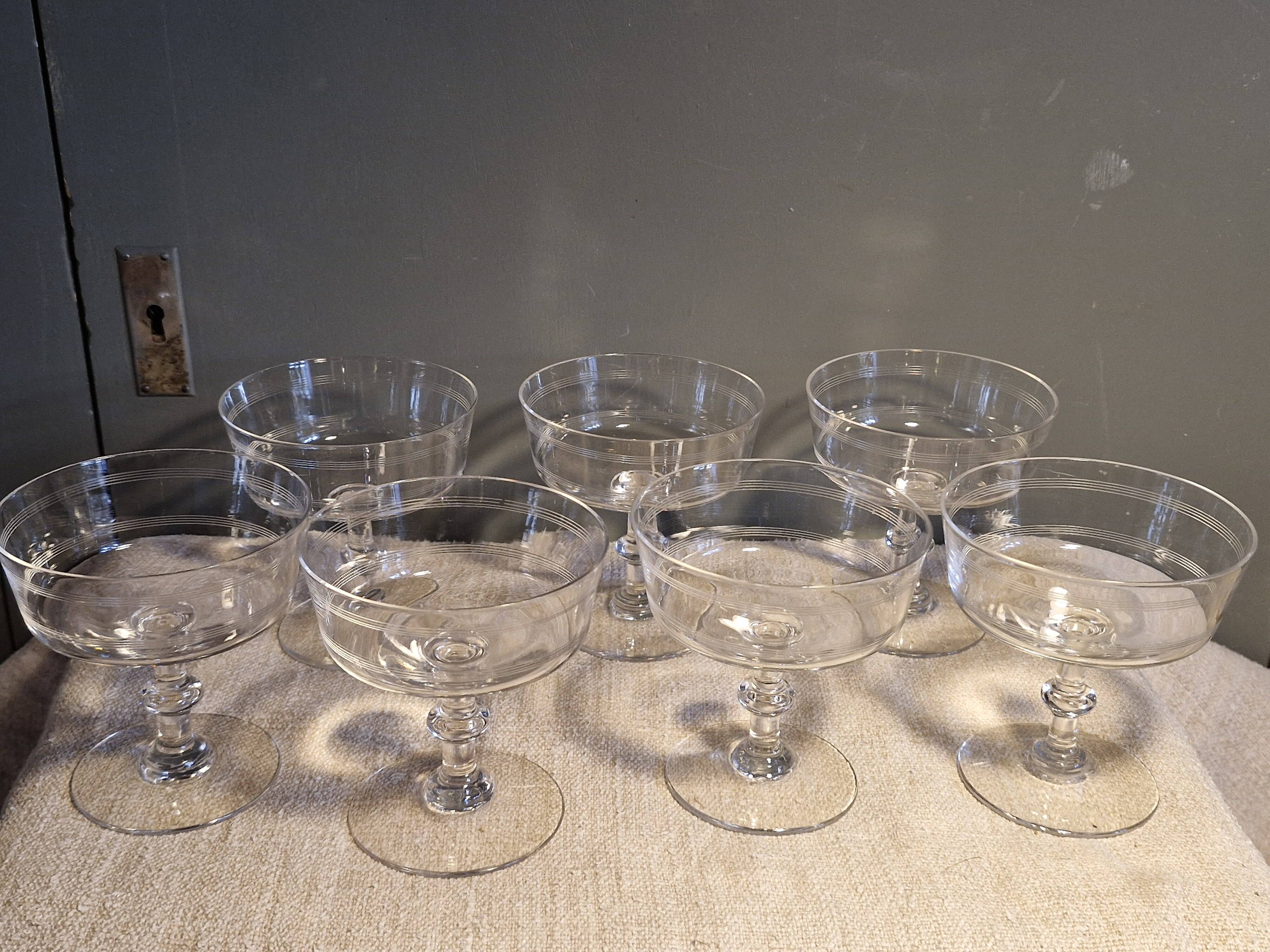 7 crystal champagne coupes from Baccarat - engraved with fillets