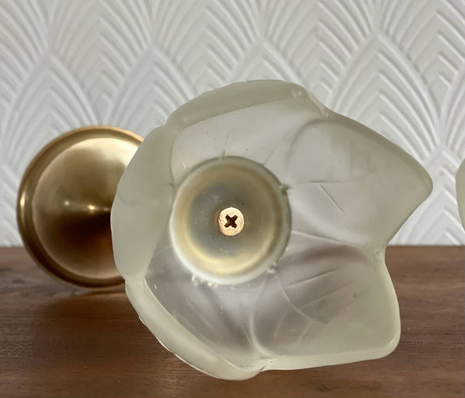 Pair of tulip-shaped candle holders in frosted glass and brass.