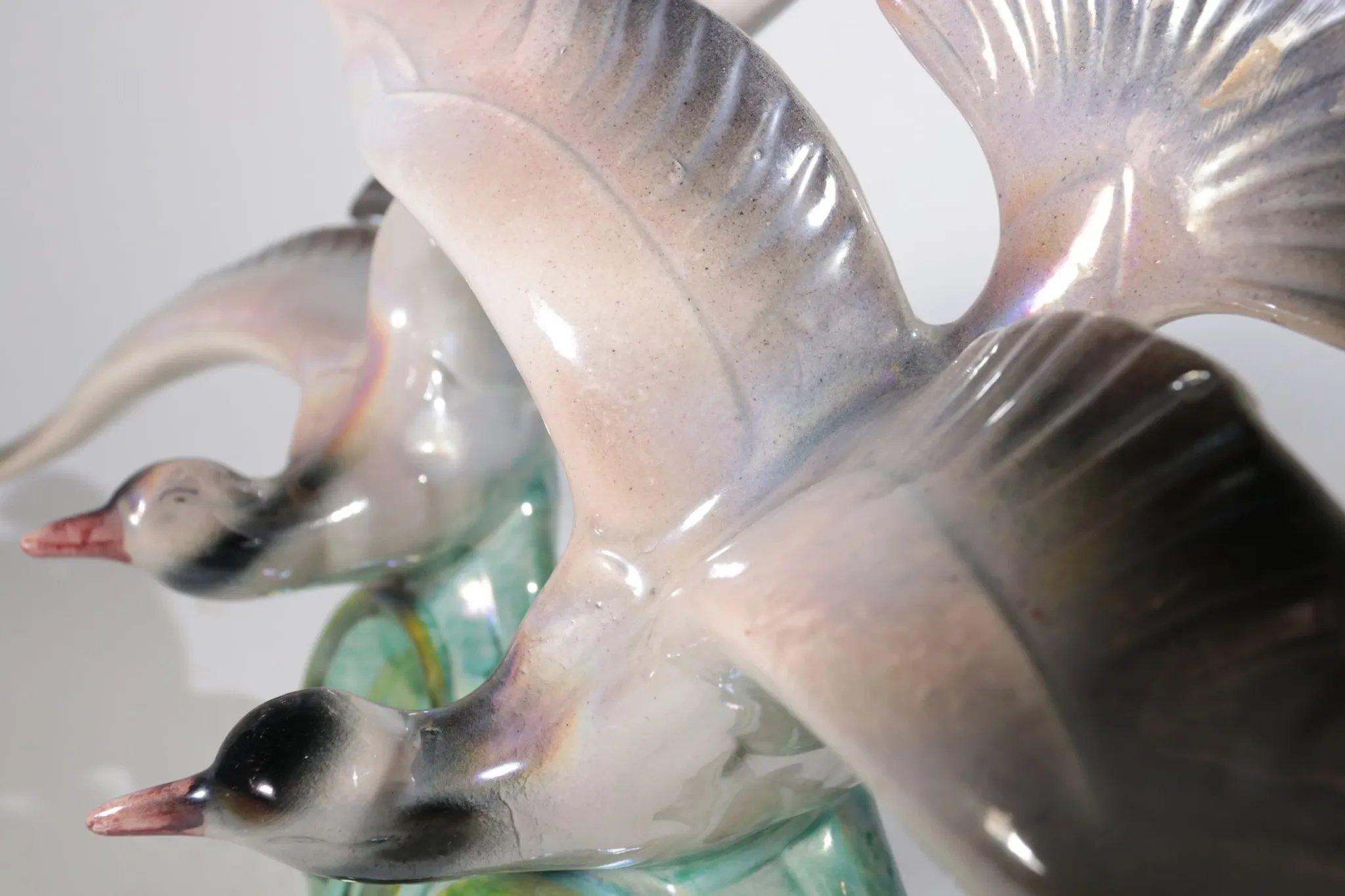 Art deco porcelain sculpture of two flying birds – iridescent, 1920s