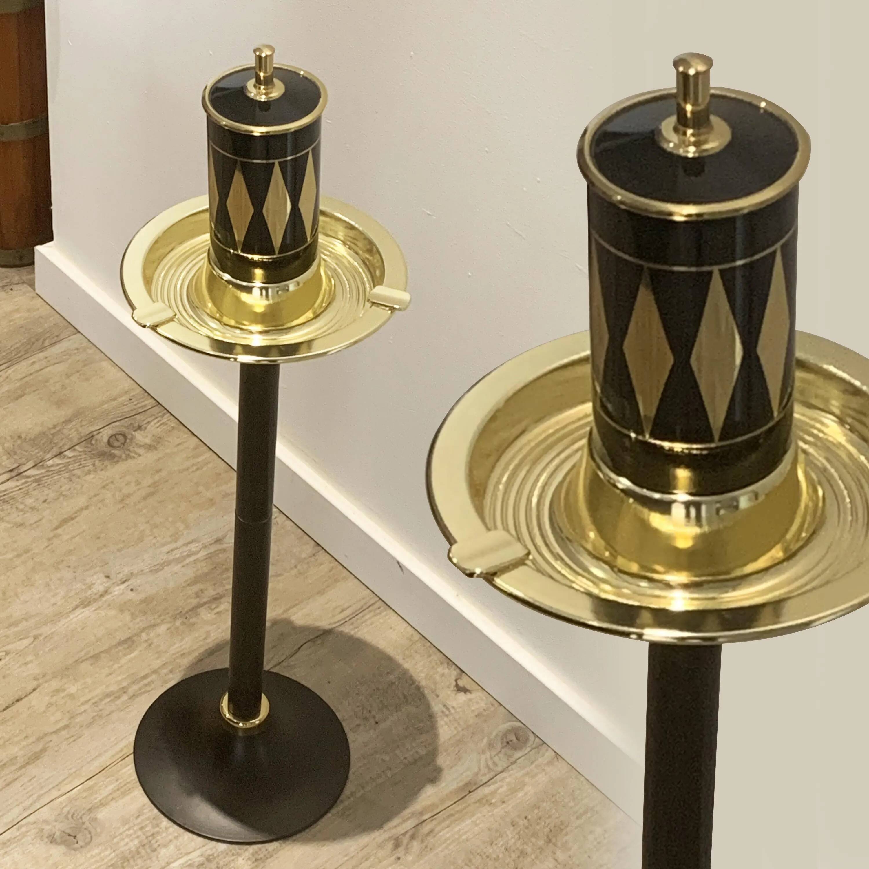 Vintage standing ashtray with cigarette dispenser in gold and black