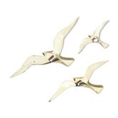 Trio of seagulls in brass