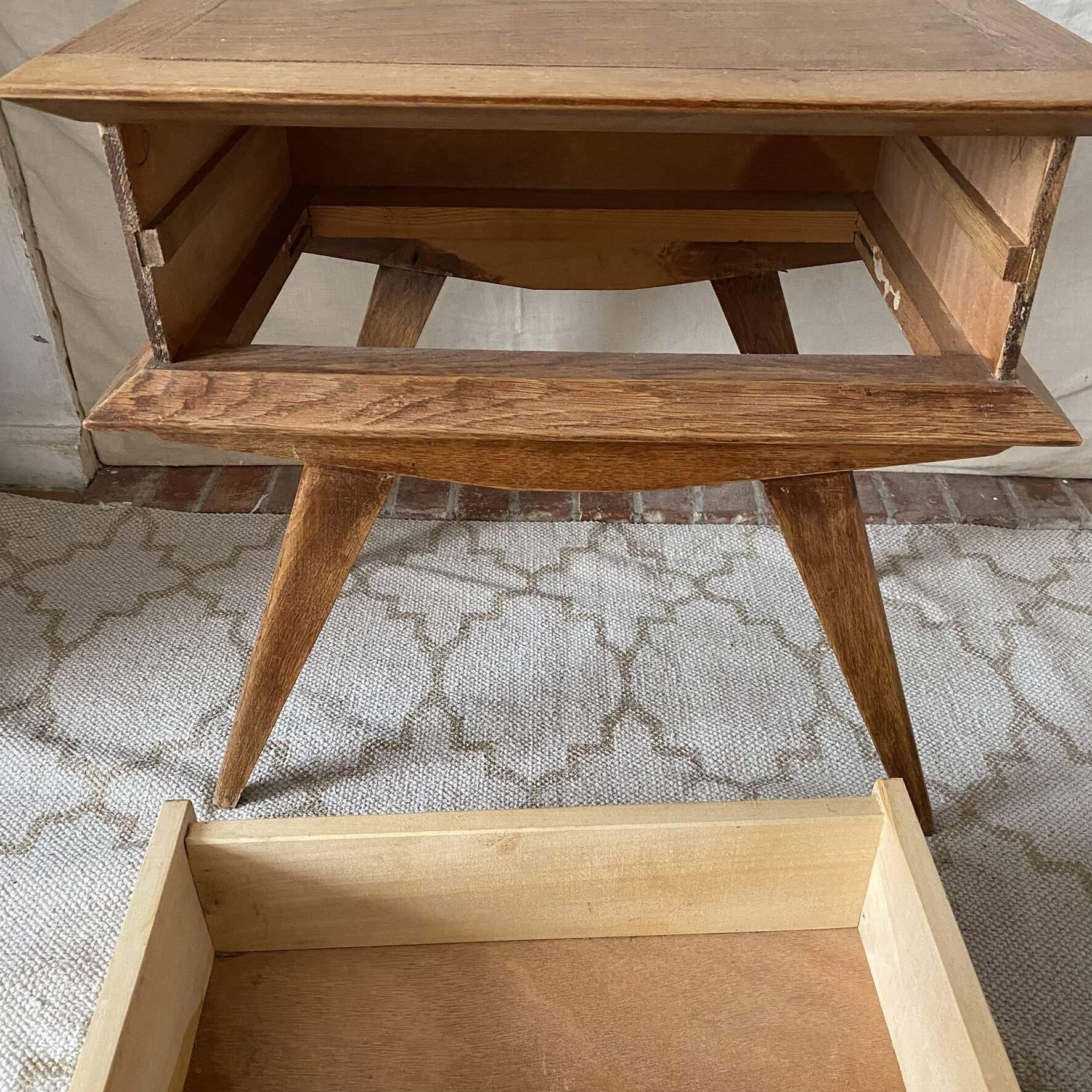 Scandinavian style bedside table with tapered legs from the 1960s.