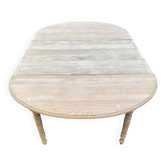 Renovated Louis Philippe round extendable dining table with 4 leaves.