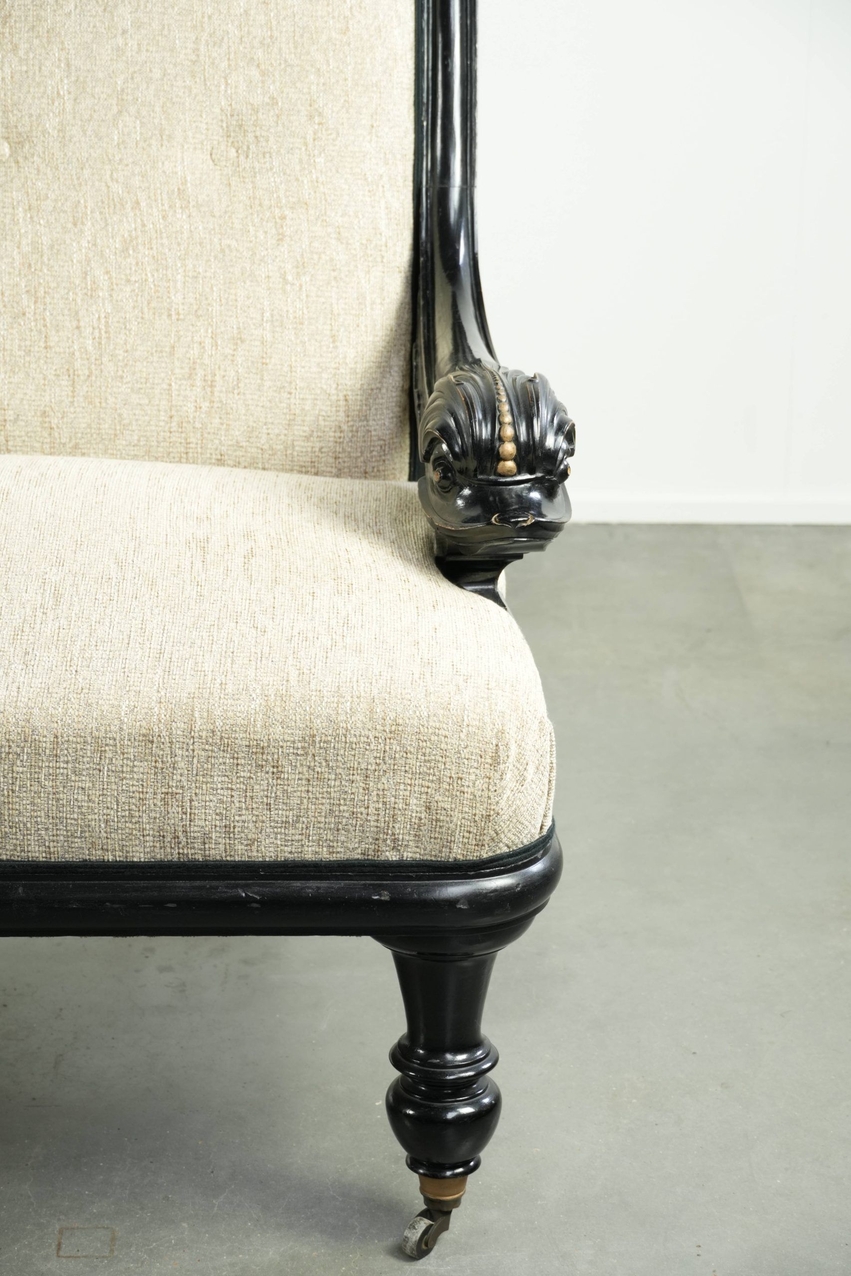 French sofa from the 19th century in Empire style with detailed armrests