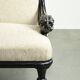 French sofa from the 19th century in Empire style with detailed armrests
