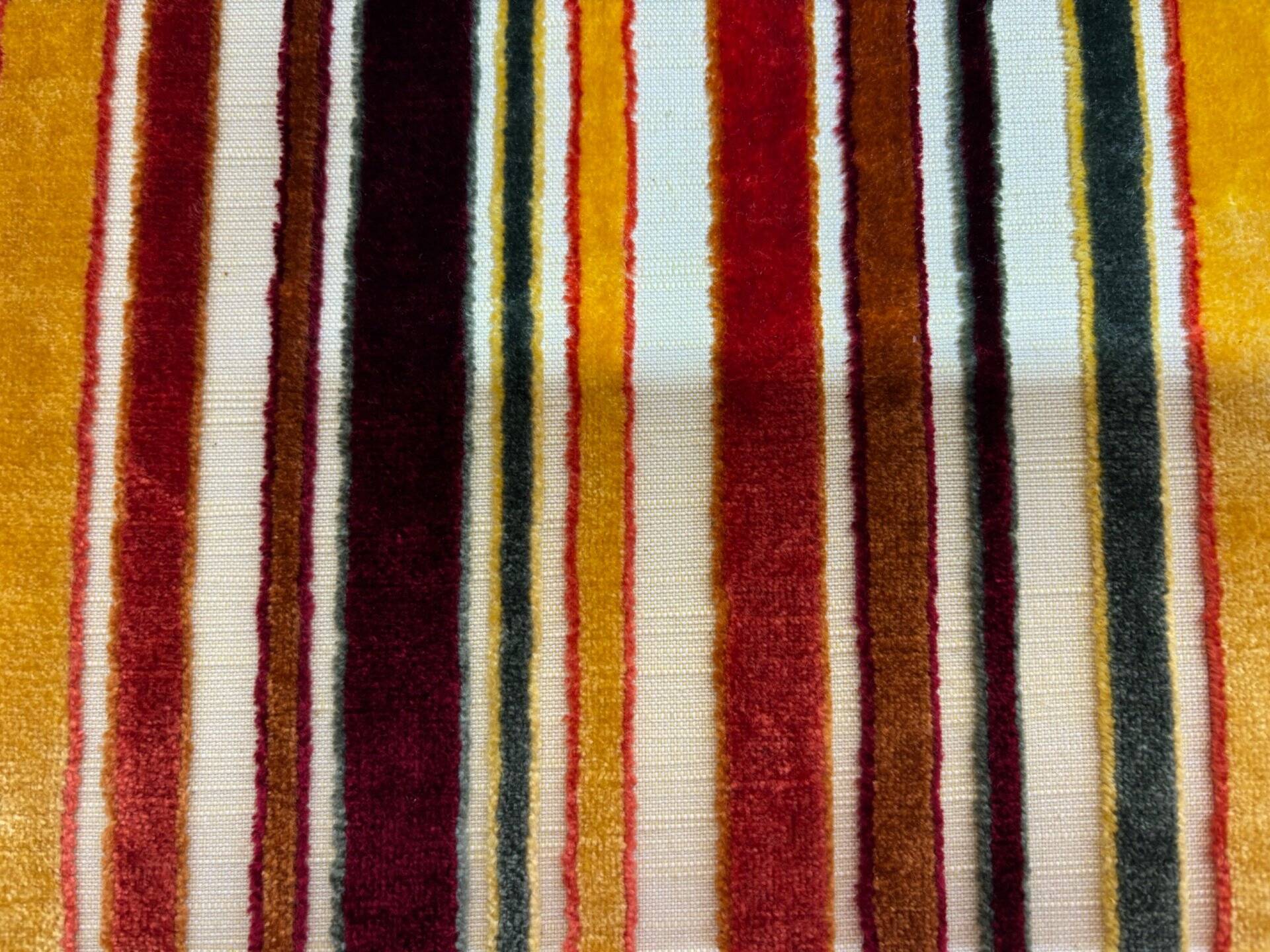 Art Deco armchair in multicolored striped fabric and its footrest