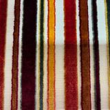 Art Deco armchair in multicolored striped fabric and its footrest