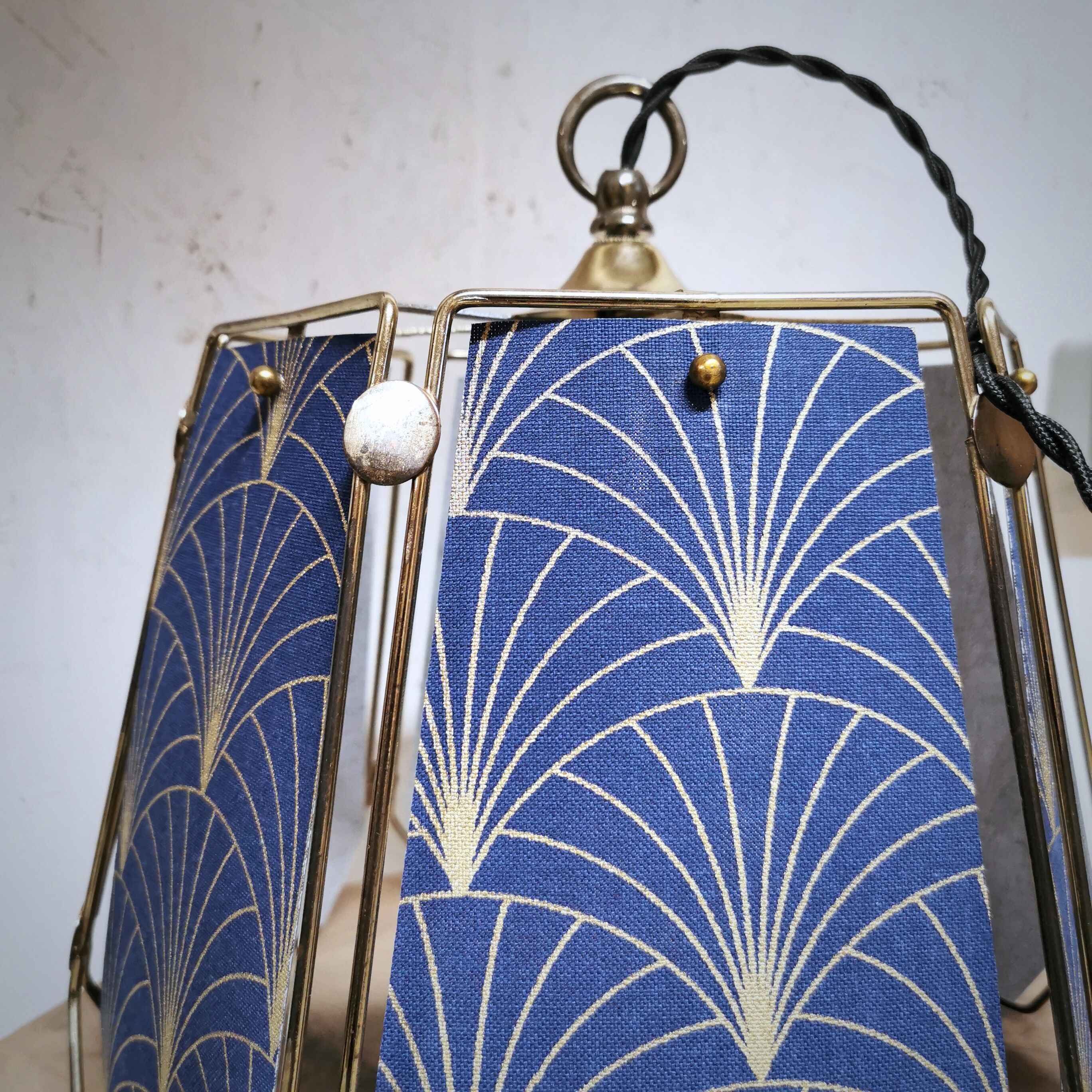 Table lamp, old turned wooden foot, metal lampshade and art deco print