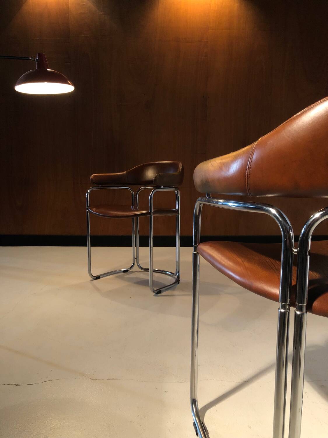 Pair of vintage armchairs, cognac leather and chrome steel 1970