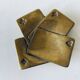 Empty pocket square of aces in brass