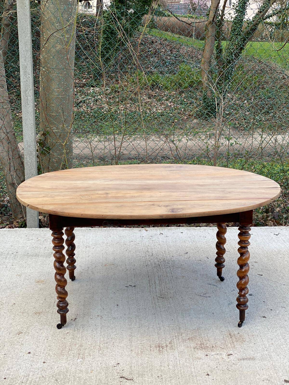 Louis Philippe oval table with shutters, 19th century, solid oak wood, twisted leg