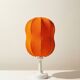 Lamp with a plastic base and a coloured fabric shade in Mid Century style.