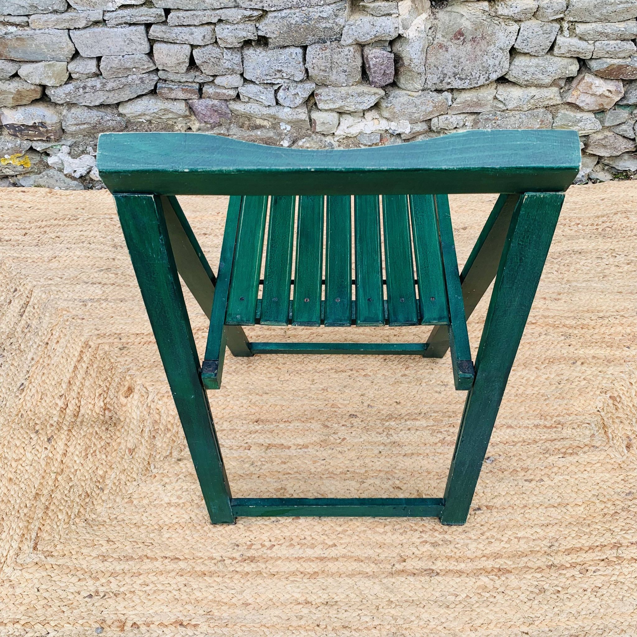 Set of 4 green folding chairs