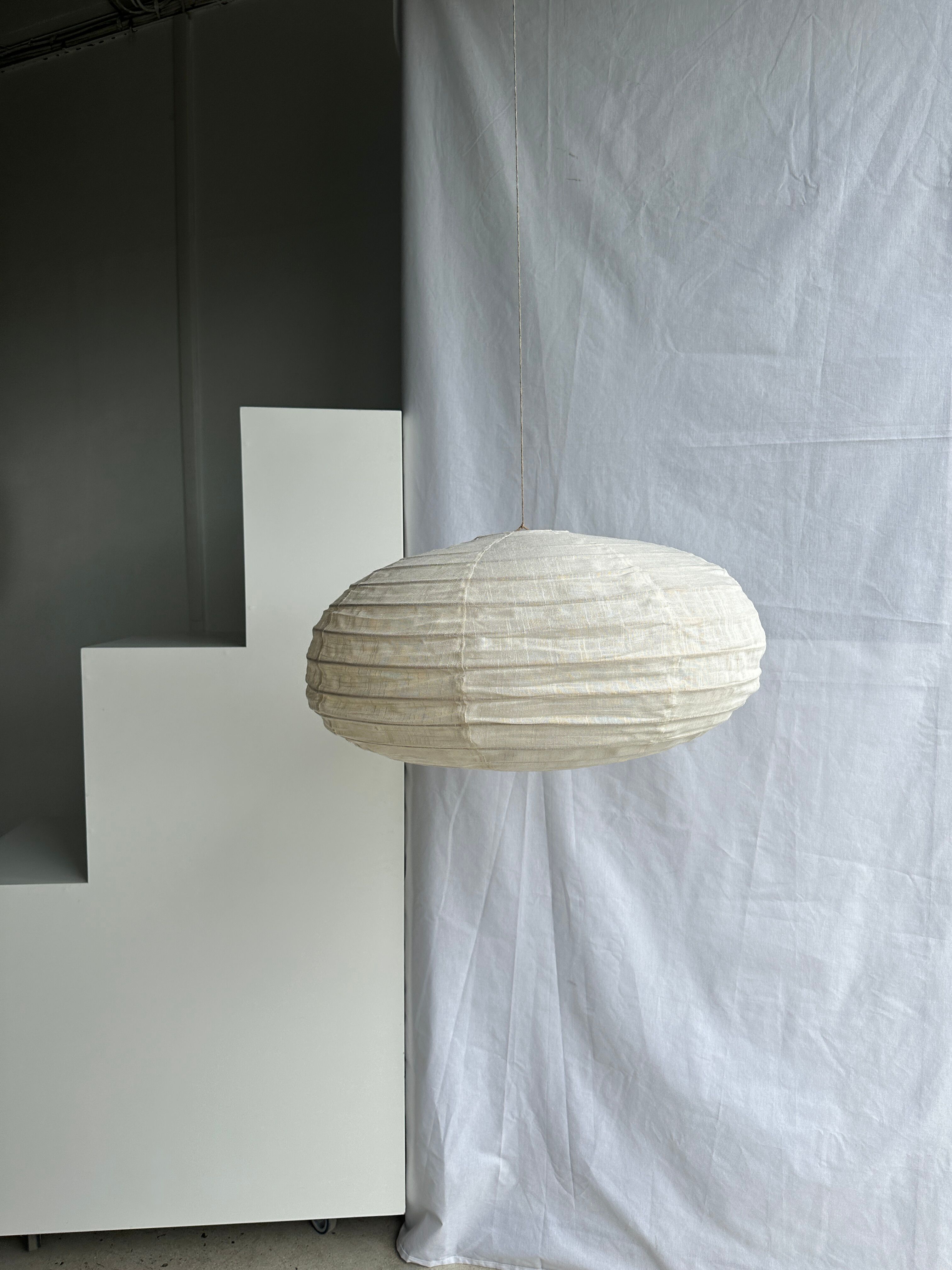 Suspension in rattan and natural linen Japanese style flattened oval h35 d60