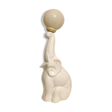 Lampe de table en céramique blanche, éléphant tenant une boule allumée