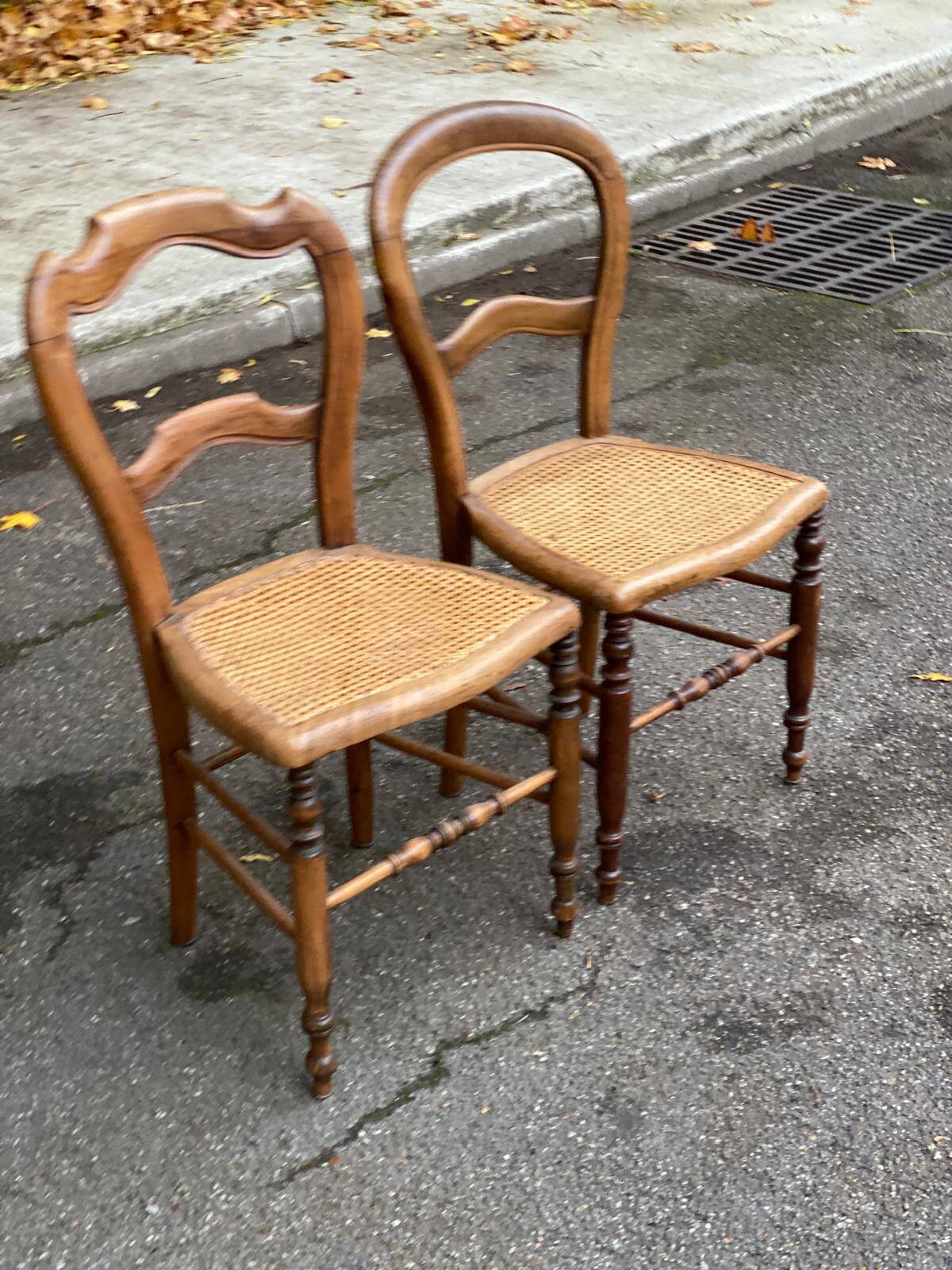 Two Louis Philippe cane chairs in solid carved wood from the 20th century