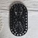 Vintage black cast iron oval trivet - Openwork design