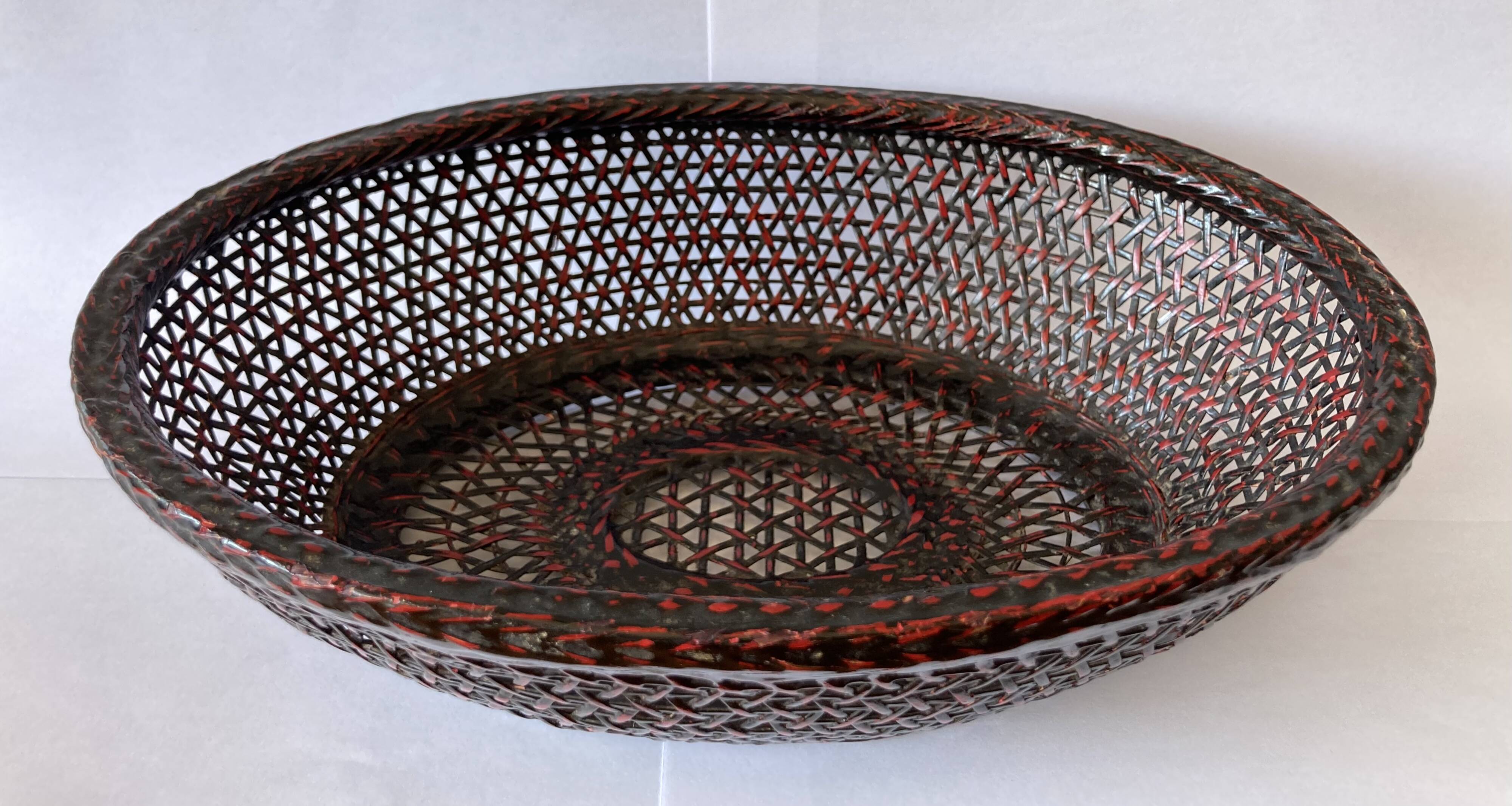 Japanese oval basket in negoro lacquered basketry (red lacquer on black background)