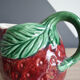 Strawberry-shaped slurry jug