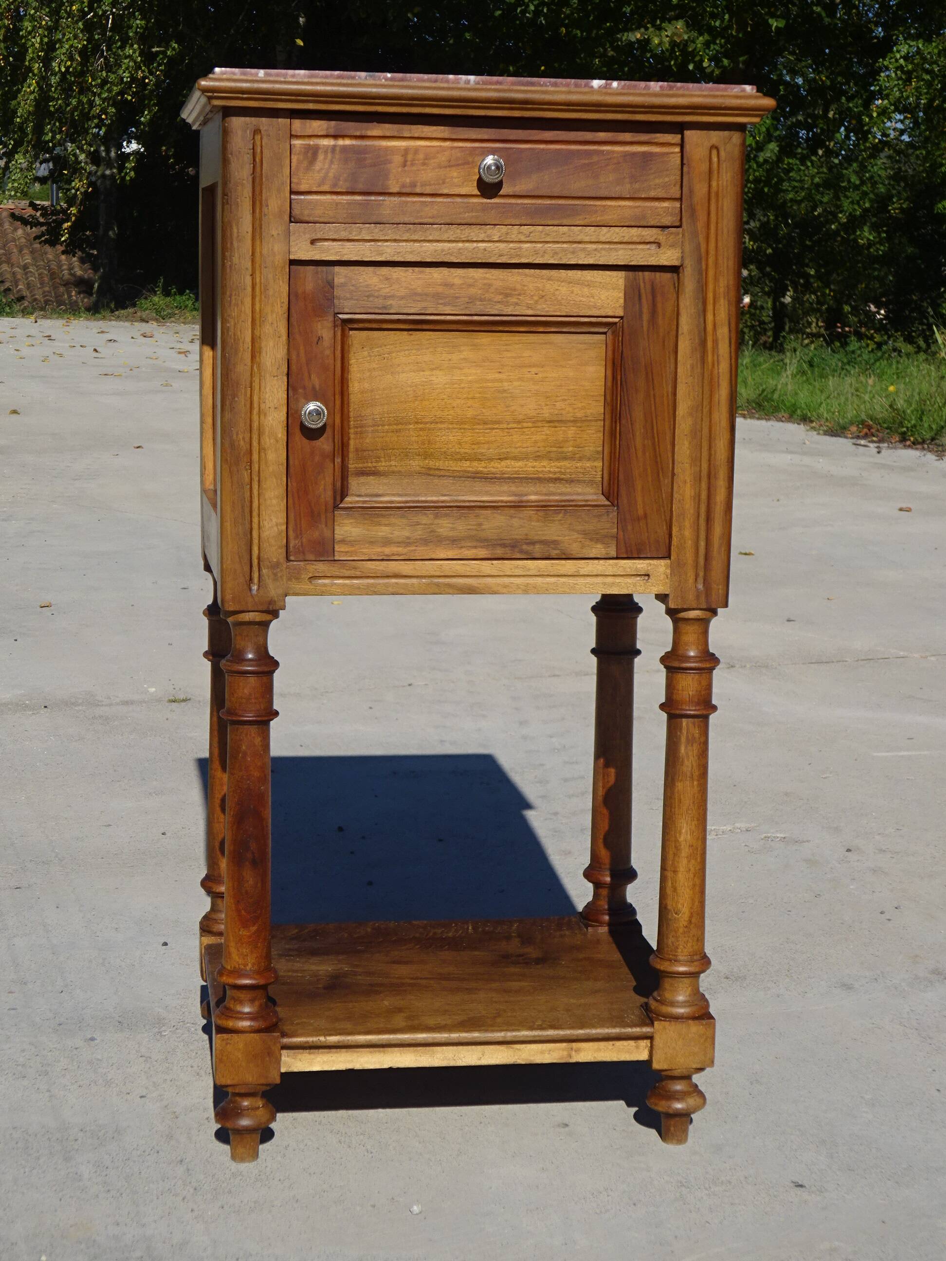 Antique Louis XVI style bedside table in walnut, with a marble top.