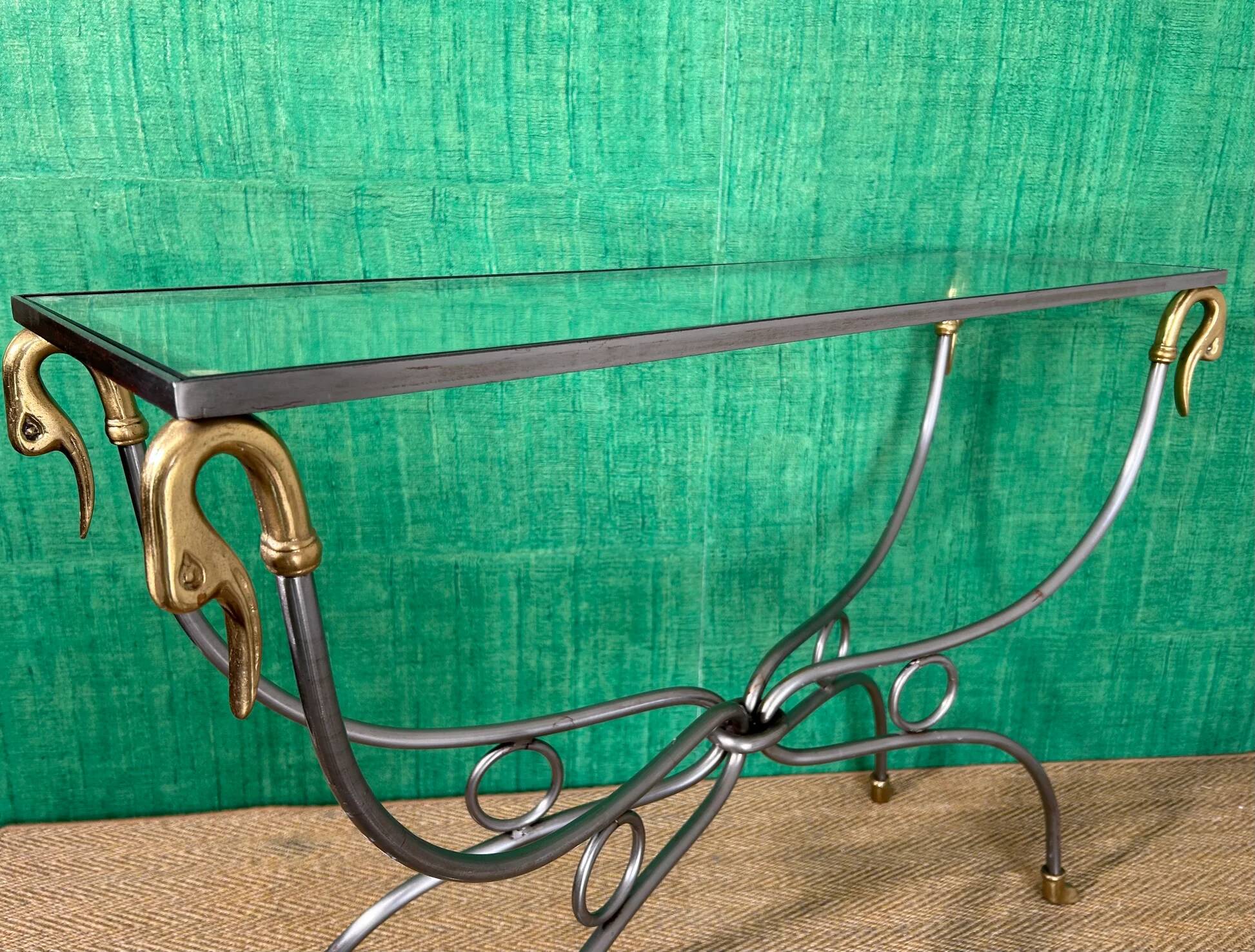 Polished steel and brass console, probably Maison Jansen, France, mid-century modern Hollywood Regency.