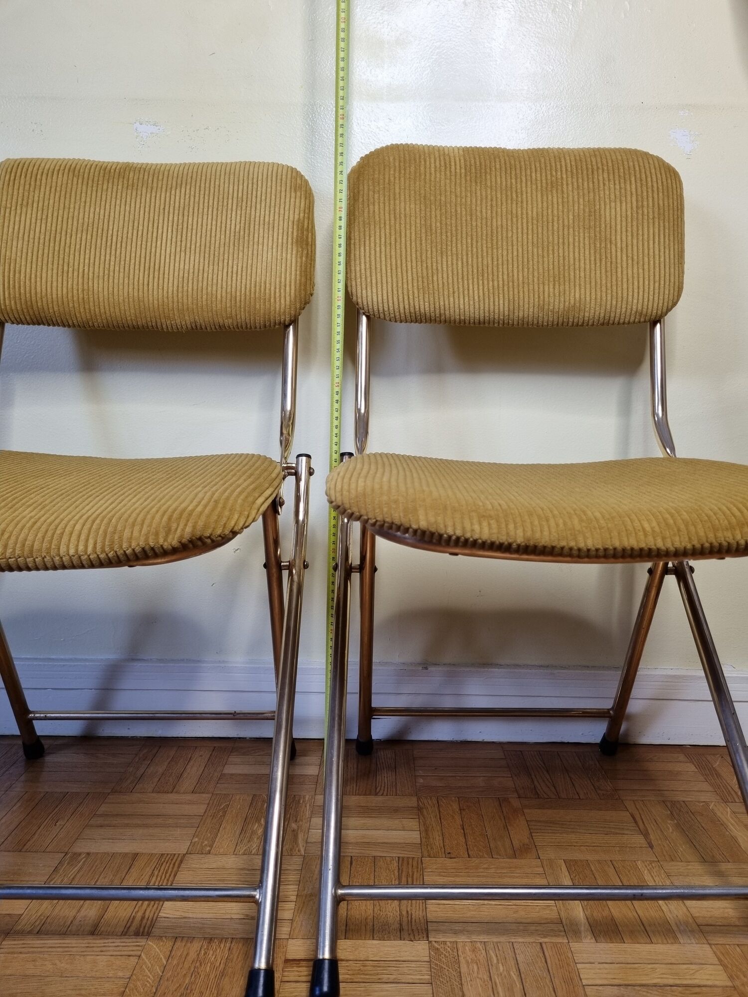 Pair of vintage folding chairs in gilded metal and 70s fabrics, restored